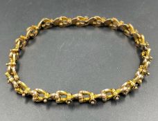 A 9ct gold articulated bracelet (Approximate total weight 13.4g)