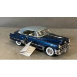 A Franklin Mint Diecast model of a 1949 Cadillac Coupe De Ville