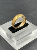 A gold wedding band ,inscribed from the inside for 1900 (Approximate total weight 6.2g) Size T