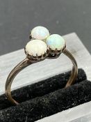 A three stone Opal ring, on untested gold setting. Size S