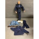 A vintage naval Action Man figure with accessories to include rifle, dagger and clothes