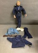 A vintage naval Action Man figure with accessories to include rifle, dagger and clothes