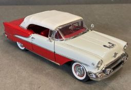 A Diecast model of a 1955 Oldsmobile Super Eight Convertible, boxed