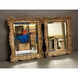 A pair of gilt framed weathered wall mirrors