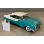 A Franklin Mint Diecast model of a 1955 Pontiac Star chief, boxed