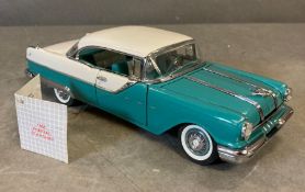 A Franklin Mint Diecast model of a 1955 Pontiac Star chief, boxed