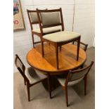 A teak G-Plan circular table on tapering legs along with six Mid Century chairs (H74cm Dia123cm)