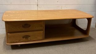 A Mid Century style teak coffee table with two drawers and storage under (H40cm W123cm D54cm)