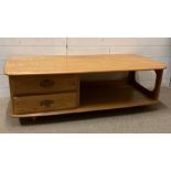 A Mid Century style teak coffee table with two drawers and storage under (H40cm W123cm D54cm)