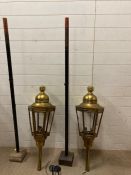 Two large brass wall sconce lanterns