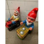 Two gnomes, one sat on a tractor and one with a trolly (H35cm)