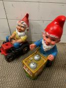 Two gnomes, one sat on a tractor and one with a trolly (H35cm)