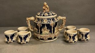 An antique German punch bowl and six cups in blue and white from the palatinate region