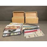 Two Wooden collectors boxes containing a range of Royal Mail mint collectors stamp packs (