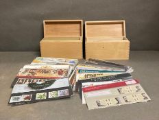 Two Wooden collectors boxes containing a range of Royal Mail mint collectors stamp packs (