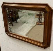 A rectangular wall mirror with bevel mirror glass (76cm x 55cm)