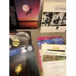 A selection of vinyl records including Genesis, The Beach Boys, Kool and the Gang