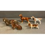 A selection of ceramic dogs to include Dachshunds, Bassett Hound and a Pointer