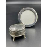 A small circular hallmarked silver picture frame and a jewellery box on four feet (AF)