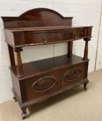 A mahogany serving buffet, a galleried top on four supports ending in a two door cabinet (H129cm