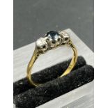 A Sapphire and diamond ring on a gold setting Size L