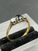 A Sapphire and diamond ring on a gold setting Size L
