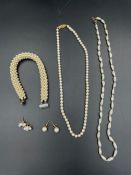 A small selection of pearl jewellery, one with a 9ct gold clasp.