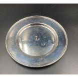 A Sterling silver offering plate with engraved L to center, approximate total weight 78g
