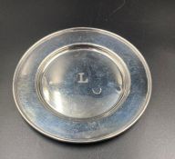 A Sterling silver offering plate with engraved L to center, approximate total weight 78g