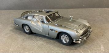 A Franklin Mint Diecast model of The James Bond Aston Martin DB5, boxed