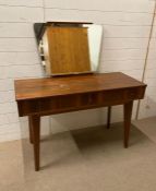 A three drawer Mid Century dressing table with mirror