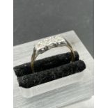 An 18ct gold and platinum setting three stone diamond ring. (Approximate Total Weight 2g) Size P
