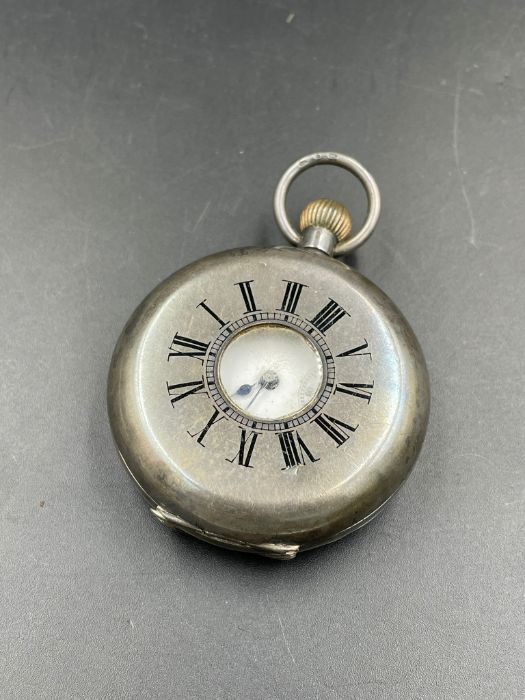 A silver half hunter pocket watch AF with inscription dated 1895.