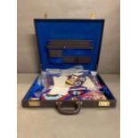 A cased selection of masonic items to include medals, sashes and aprons