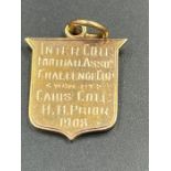 A Keys college gold sports pendant from 1908 (Approximate total weight 3.8g)