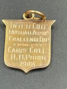A Keys college gold sports pendant from 1908 (Approximate total weight 3.8g)