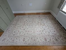 A large floral pattern rug with cream grounds and light pink flowers (350cm x 270cm)