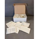 A box of stamps in packets, British Colonies mint