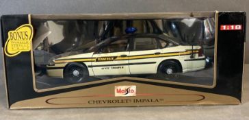 A Maisto Diecast model of a Chevrolet Impala Cop Car