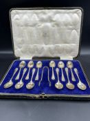 A twelve place setting teaspoon set in silver with sugar tongs, hallmarked for Sheffield 1921 by