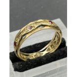A 9ct gold ring with garnets and diamonds (Approximate Total weight 3.3g) Size T