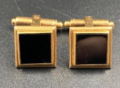 A Pair of Persian Gold Cuff Links with onyx style stones. Approximate Total Weight 13g)
