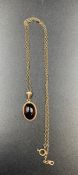 A 9ct gold pendant and chain with amber stone. (Approximate Total weight 3.8g)
