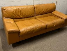 A Mid Century leather two seater sofa with a matching lounge chair and foot stool (Sofa H77cm W200cm