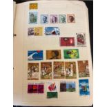 A Worldwide stamp collection in a single folder, Abu Dhabi to New Zealand.