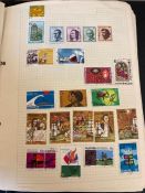 A Worldwide stamp collection in a single folder, Abu Dhabi to New Zealand.