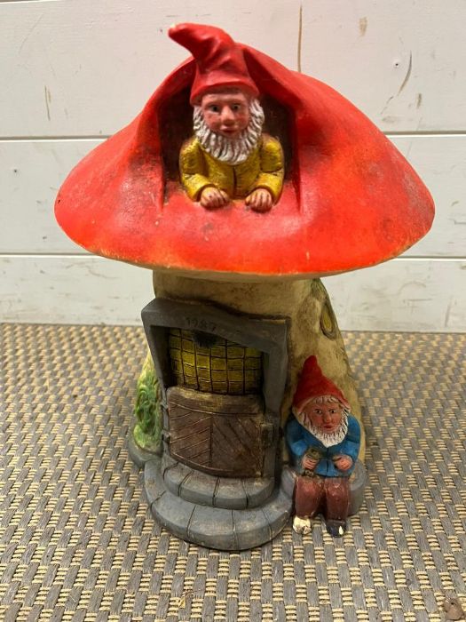 A garden gnome mushroom house