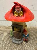 A garden gnome mushroom house