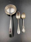 Two Sterling silver teaspoons and a sauce ladle