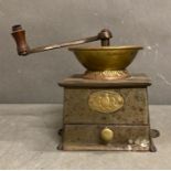 A vintage Kendrick cast iron and brass coffee grinder